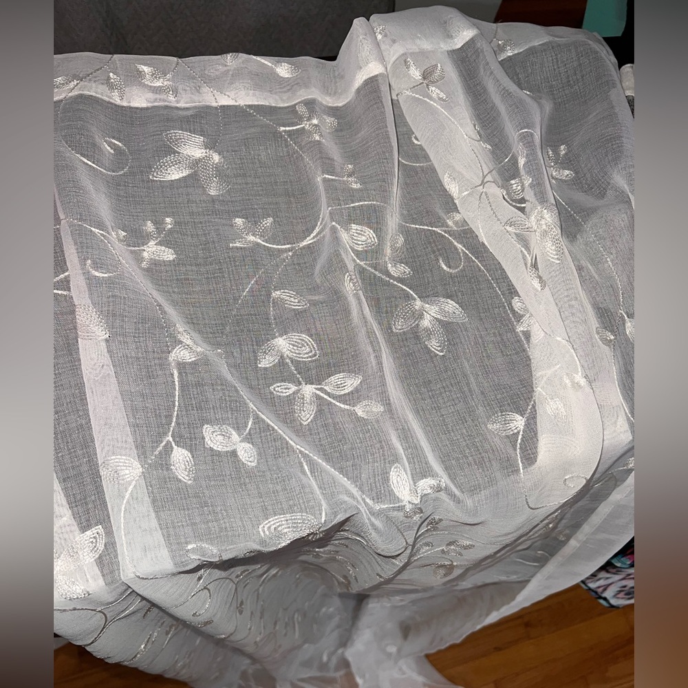 White sheer 6 panel curtains. Never used.